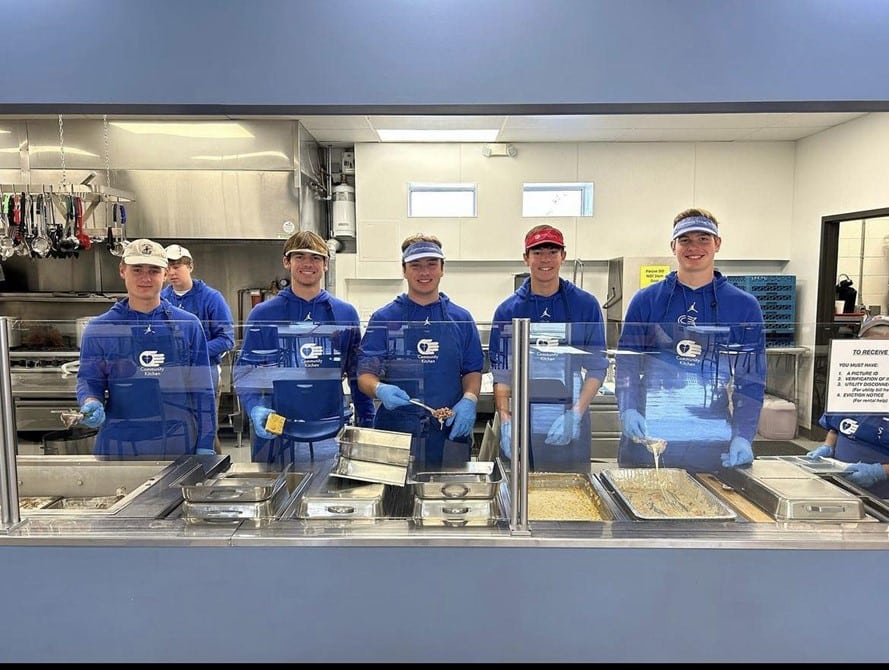 A day of serving at Community Kitchen, featuring the St. Mary basketball team