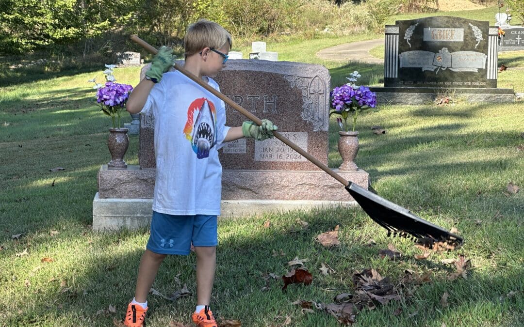 Faithful participate in works of mercy at cemetery clean-up